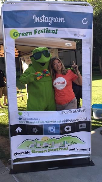 Lady taking photo with mascot